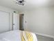 Light and airy bedroom with a modern ceiling fan, closet, neutral paint, and light wood-look floors at 1203 W 20Th St, Sanford, FL 32771