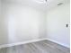 Spacious room boasts neutral paint, wood-look floors and modern light fixture at 1203 W 20Th St, Sanford, FL 32771