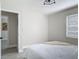 Bright bedroom with neutral walls and flooring, with decorative accents and ample light at 1203 W 20Th St, Sanford, FL 32771
