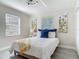 Well-lit bedroom showcasing neutral walls and wood-look flooring, complete with stylish decor at 1203 W 20Th St, Sanford, FL 32771