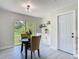 Charming dining area featuring a round table, two chairs, and sliding glass doors with backyard views at 1203 W 20Th St, Sanford, FL 32771