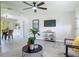 Open-concept living area with modern furnishings and natural light, adjacent to the dining area at 1203 W 20Th St, Sanford, FL 32771