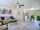 Inviting living room and kitchen feature modern decor, wood floors, and stainless steel appliances at 1203 W 20Th St, Sanford, FL 32771
