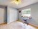 Bright bedroom with tile floors, window, closet, and keyboard on a stand at 1229 Jeffery Dr, Port Orange, FL 32129