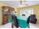 Bright dining room with tile floors, large bay window, hutch, and ceiling fan at 1229 Jeffery Dr, Port Orange, FL 32129