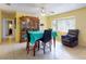 Bright dining room with tile floors, large bay window, and a decorative hutch at 1229 Jeffery Dr, Port Orange, FL 32129