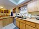 The eat-in kitchen has light wood cabinetry and a stainless steel dishwasher at 1229 Jeffery Dr, Port Orange, FL 32129