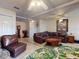 A corner of a comfortable living room with cozy seating and an island rug at 1229 Jeffery Dr, Port Orange, FL 32129