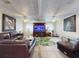 Bright and open living room with comfortable seating and a tropical rug at 1229 Jeffery Dr, Port Orange, FL 32129