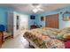 A bright and spacious main bedroom featuring a ceiling fan and en suite bathroom at 1229 Jeffery Dr, Port Orange, FL 32129