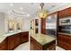 Bright kitchen with marble countertops, custom cabinetry and stainless steel appliances at 1324 Dovercourt Ln, Ormond Beach, FL 32174