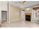 Inviting living room with a fireplace and large windows providing natural light at 1324 Dovercourt Ln, Ormond Beach, FL 32174