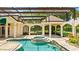 Enclosed pool area with spa, pavilion and backyard at 1324 Dovercourt Ln, Ormond Beach, FL 32174