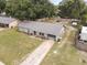 Aerial view of a single Gathering home with a driveway and large backyard at 137 Fort Smith Blvd, Deltona, FL 32738