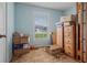 Bedroom featuring a window, paint in baby blue, and boxes at 137 Fort Smith Blvd, Deltona, FL 32738