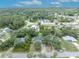 Aerial view of a charming home surrounded by lush mature trees at 1398 5Th Ave, Deland, FL 32724
