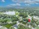 An aerial view highlights this tranquil neighborhood and the proximity of this home to the nearby lake and preserves at 1398 5Th Ave, Deland, FL 32724