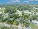 Aerial view of a charming home with mature trees in a lush neighborhood at 1398 5Th Ave, Deland, FL 32724