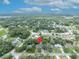 Aerial view pinpoints this charming single Gathering home nestled within a peaceful, verdant suburban community at 1398 5Th Ave, Deland, FL 32724