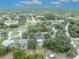 This aerial view captures this home with a lush, verdant backyard, within a well-established neighborhood at 1398 5Th Ave, Deland, FL 32724