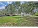 Spacious backyard with play equipment and deck at 1398 5Th Ave, Deland, FL 32724
