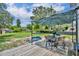 Backyard featuring a deck with outdoor dining area and pool at 1398 5Th Ave, Deland, FL 32724