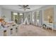 Bright bedroom with a teepee, neutral carpet, and access to an outdoor patio at 1398 5Th Ave, Deland, FL 32724