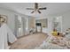 Cozy bedroom with neutral walls, carpet flooring, and a ceiling fan at 1398 5Th Ave, Deland, FL 32724