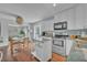 Bright kitchen features white cabinetry, modern appliances, and an island for extra counter space at 1398 5Th Ave, Deland, FL 32724