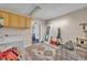 Spacious laundry room featuring a washer, dryer, cabinetry, and decorative rug at 1398 5Th Ave, Deland, FL 32724