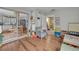 Playroom leading to kitchen area and featuring a gray armchair and toys at 1398 5Th Ave, Deland, FL 32724