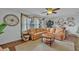 Cozy living room features hardwood floors, a tan sofa, and plenty of natural light at 1398 5Th Ave, Deland, FL 32724