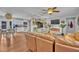 Living room opens to the kitchen with wood floors, light walls, and modern finishes at 1398 5Th Ave, Deland, FL 32724