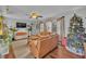 Open living room featuring a large tan sofa, wood flooring, and natural light at 1398 5Th Ave, Deland, FL 32724