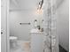 Updated bathroom featuring a white vanity and a shower with gray accents at 1402 E Voorhis Ave, Deland, FL 32724