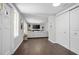 Welcoming entryway featuring hardwood floors and views into the living room at 1402 E Voorhis Ave, Deland, FL 32724