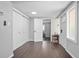 Bright entryway featuring hardwood floors and closet storage at 1402 E Voorhis Ave, Deland, FL 32724