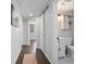 Hallway with a full bathroom that includes a white vanity at 1402 E Voorhis Ave, Deland, FL 32724