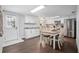 Bright eat-in kitchen with white cabinetry and stainless steel appliances at 1402 E Voorhis Ave, Deland, FL 32724