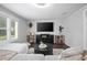 Cozy living room with modern entertainment center at 1402 E Voorhis Ave, Deland, FL 32724