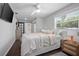 Bright main bedroom with a barn door leading into the main bathroom at 1402 E Voorhis Ave, Deland, FL 32724