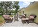 Charming patio featuring comfortable outdoor seating, perfect for relaxing and entertaining guests at 1402 E Voorhis Ave, Deland, FL 32724