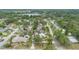 Scenic neighborhood with established homes, verdant trees, and a glimpse of the lake at 1411 Cliff Ave, Eustis, FL 32726