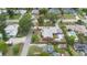 A residential area with well-kept homes, mature trees, and swimming pool at 1411 Cliff Ave, Eustis, FL 32726