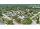 A neighborhood featuring lush greenery surrounding cozy homes, some with private pools at 1411 Cliff Ave, Eustis, FL 32726