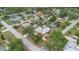 Community with well-kept homes, mature trees, and a mix of architectural styles at 1411 Cliff Ave, Eustis, FL 32726