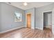 Empty bedroom with hardwood floors, ceiling fan and closet at 1411 Cliff Ave, Eustis, FL 32726