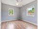 Empty bedroom with hardwood floors and natural light at 1411 Cliff Ave, Eustis, FL 32726