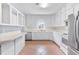 Bright kitchen features stainless steel refrigerator, range, and plenty of cabinet and countertop space at 1411 Cliff Ave, Eustis, FL 32726