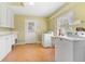 Bright laundry room with washer, dryer, utility sink, shelving and plenty of storage space at 1411 Cliff Ave, Eustis, FL 32726